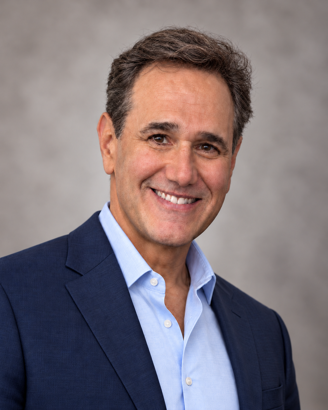Darren Blatt, founder of MarketingFirm, in a navy jacket and light blue shirt